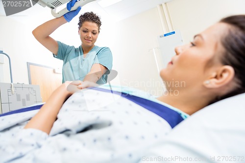 Image of Nurse Preparing Patient For Xray