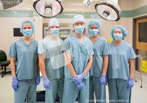 Image of Confident Medical Team Standing In Operation Room