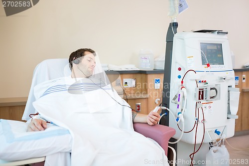 Image of Patient Listening To Music While Receiving Renal Dialysis