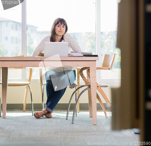 Image of Portrait Of Student Sitting In Library