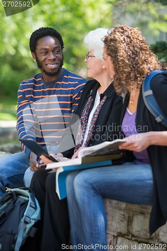 Image of College Professor Helping Students