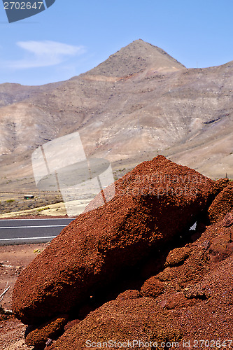 Image of volcanic timanfaya  red rock stone sky  