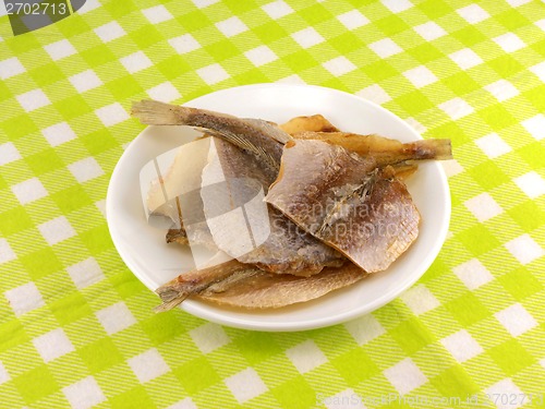 Image of Dried fish on white plate