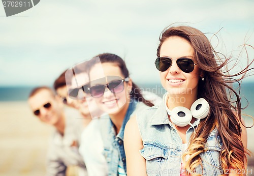 Image of teenage girl with friends outside