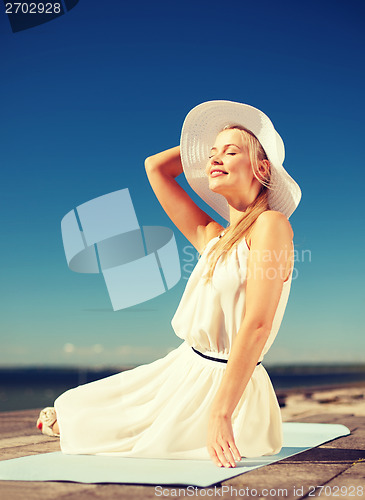 Image of beautiful woman enjoying summer outdoors