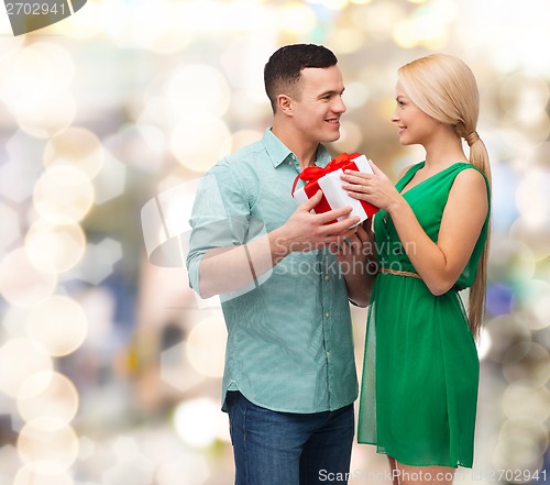 Image of smiling couple with gift box