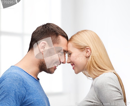 Image of smiling couple looking at each other