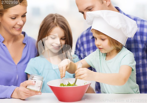 Image of happy family with two kids eating at home