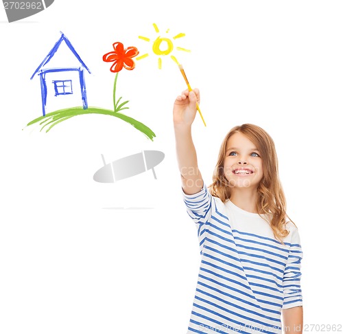 Image of cute little girl drawing house with brush