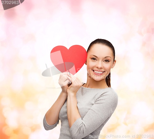 Image of smiling asian woman with red heart
