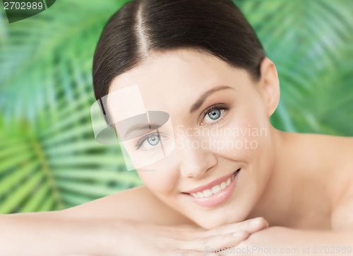 Image of smiling woman in spa salon