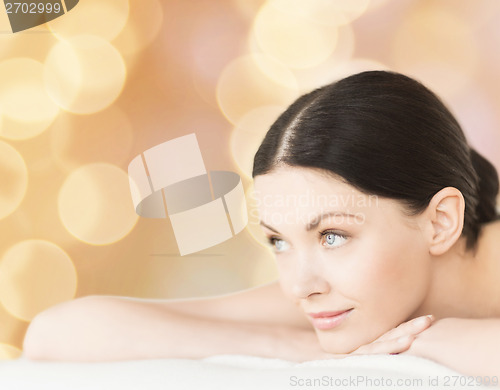 Image of smiling woman in spa salon