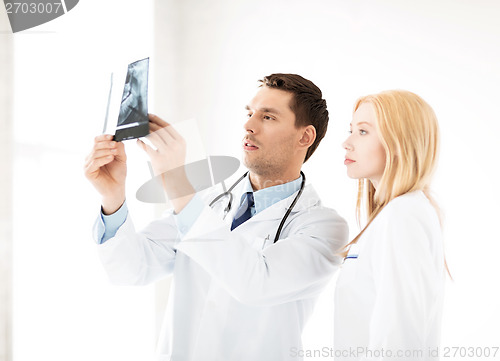 Image of two doctors looking at x-ray