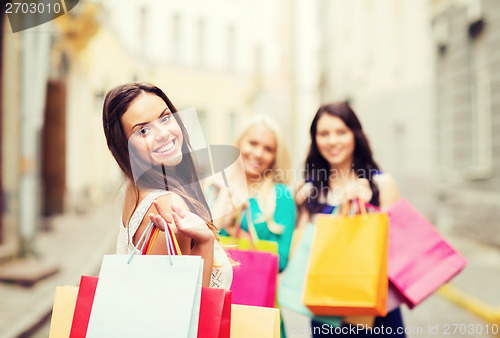 Image of girls with shopping bags in city
