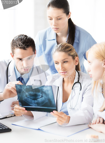 Image of young group of doctors looking at x-ray