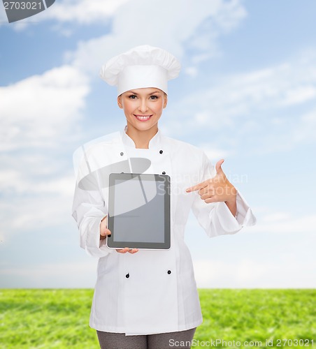 Image of smiling female chef with tablet pc blank screen