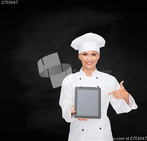 Image of smiling female chef with tablet pc blank screen