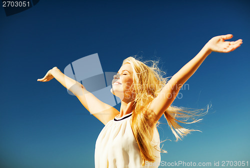 Image of beautiful woman enjoying summer outdoors