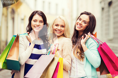 Image of girls with shopping bags in city