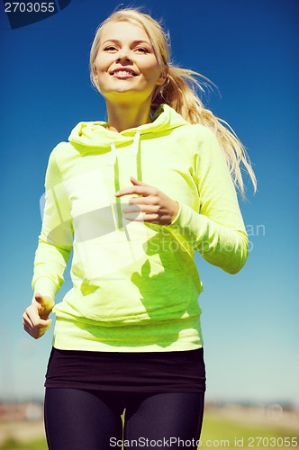 Image of woman jogging outdoors