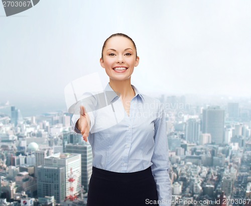 Image of businesswoman with opened hand ready for handshake