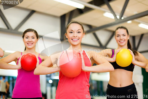 Image of group of people working out with stability balls