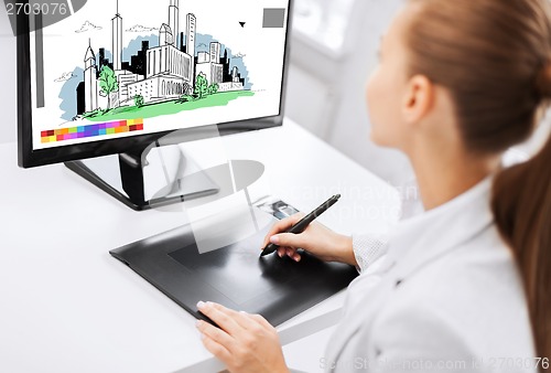 Image of architect with drawing tablet in office