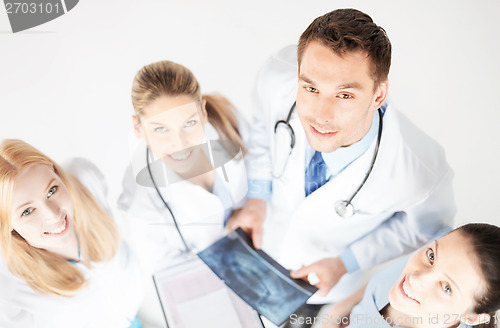 Image of young group of doctors looking at x-ray