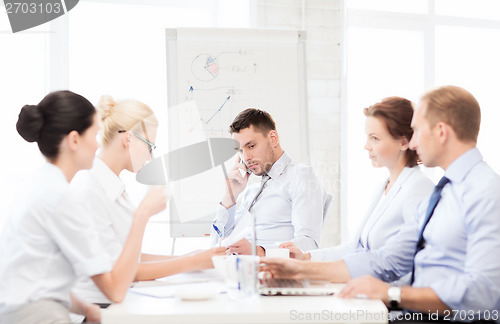 Image of stressed male boss on business meeting