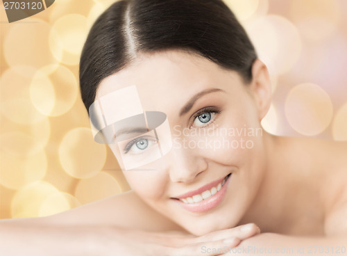 Image of smiling woman in spa salon