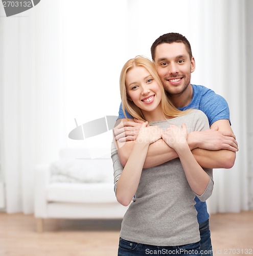 Image of smiling couple hugging