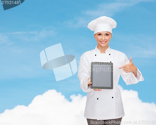 Image of smiling female chef with tablet pc blank screen