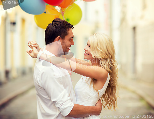 Image of couple with colorful balloons