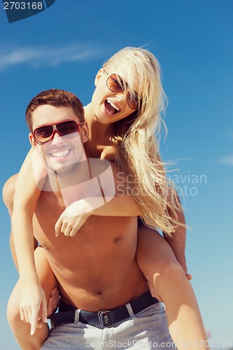 Image of couple having fun on the beach