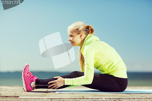Image of woman doing sports outdoors