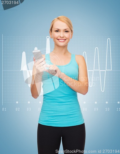 Image of sporty woman with smartphone