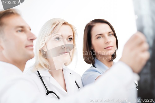 Image of doctors looking at x-ray