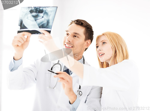 Image of two doctors looking at x-ray