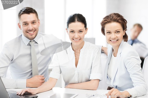 Image of business team working in office