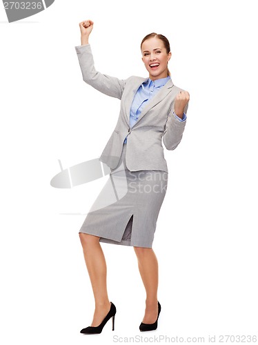 Image of happy businesswoman with hands up