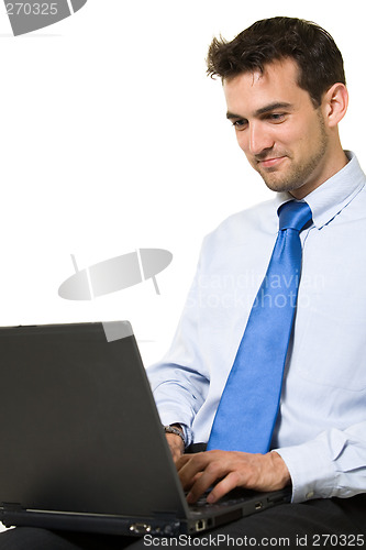 Image of Man working on laptop