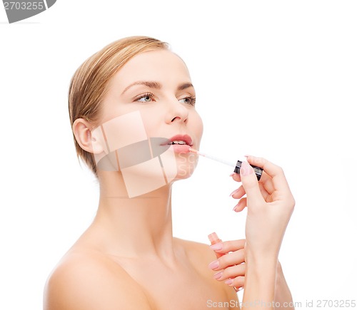 Image of beautiful woman with lipgloss