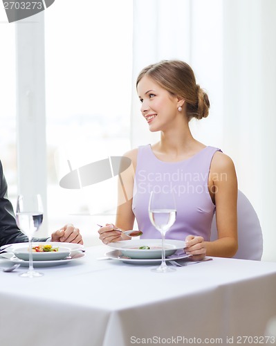 Image of young woman looking at husband or boyfriend