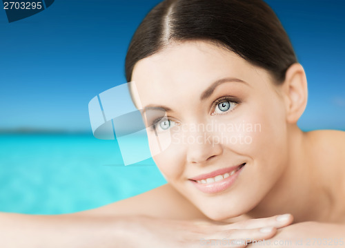 Image of smiling woman on the beach