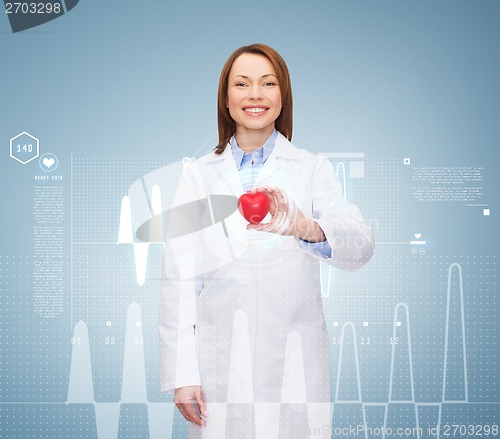 Image of smiling female doctor with heart