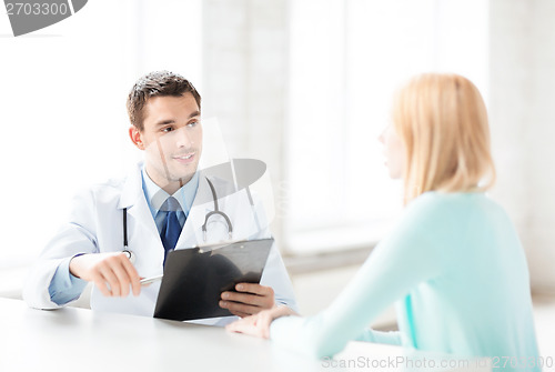 Image of male doctor with patient