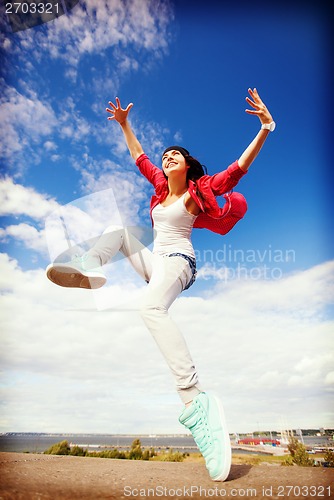 Image of beautiful dancing girl jumping