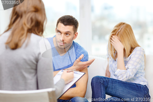 Image of young couple with a problem at psychologist office