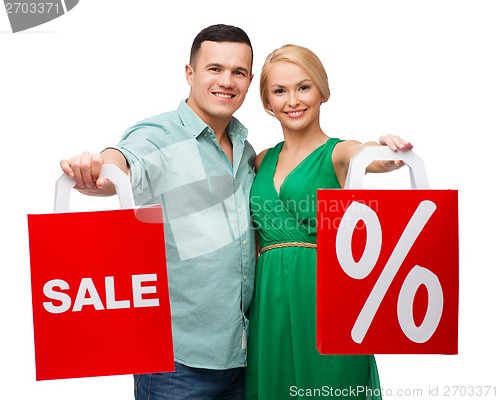 Image of smiling couple with shopping bags