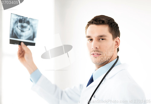 Image of male doctor or dentist with x-ray